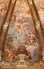 Obraz premium CREMA, ITALY - MARCH 20, 2026: The fresco of angels with the Crucifixion instruments (spear) in cupola of the church Santuario di Santa Maria della Croce by Giacomo Parravicino (1702). 