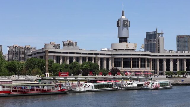 Tianjin Railway Station Clock Tower and Hai River Tour Boats in China