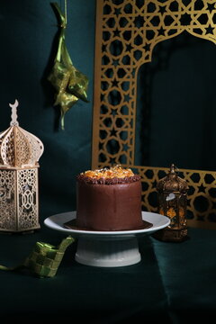 Rich chocolate cream coated cake topped with caramel glaze, nice angle view.