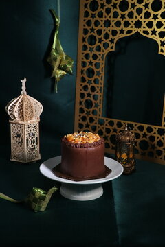 Rich chocolate cream coated cake topped with caramel glaze, nice angle view.