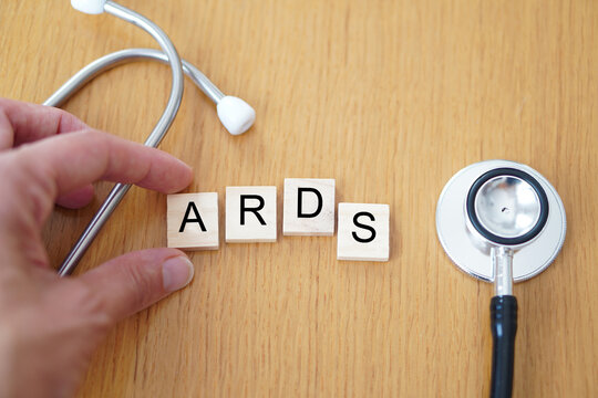 ARDS, medical concepts. Wooden letters with a stethoscope on a wooden background