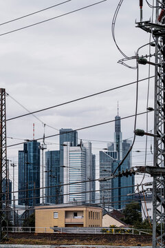 Historic church landmark anchors a Frankfurt skyline where modern skyscraper architecture rises behind forming a cityscape defined by clear contrast