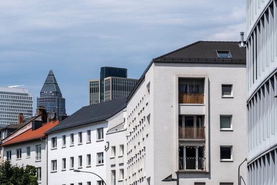 Frankfurt city skyline in daylight with clouds featuring modern architecture and tall buildings that define an urban travel scene and clear horizon