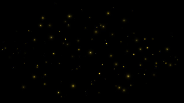Lush golden glowing dust particles on a dark black background. Dramatic abstract sparkle light effect.