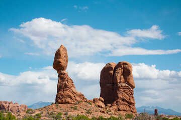 Iconic Balanced Rock formation in Arches National Park near Moab Utah, giant sandstone boulder perched on a pedestal against blue sky, famous American Southwest desert landscape photography. © Oleksandr Fursa