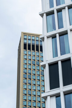 Urban architecture in frankfurt uses windows framing on a modern facade to isolate a financial office skyscraper in quiet daylight