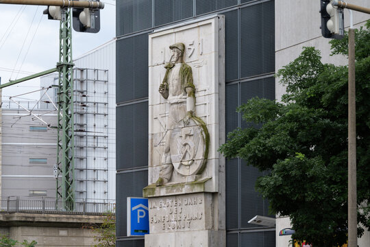 DRESDEN, GERMANY - 2. August 2025: Historic relief on a car park building in the Friedrichstadt district. The DDR (GDR) artwork out of stone is a monument of the first five-year plan of the government