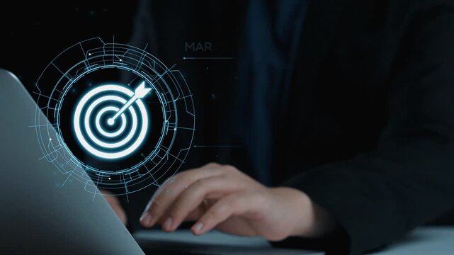 A close-up of a person hands typing on a laptop while a futuristic marketing strategy graphic radiates with a target symbol, symbolizing data-driven decision-making. Qubit