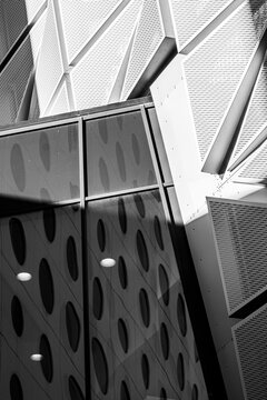 Abstract texture studies on a modern facade where geometric panels build architecture pattern symmetry in monochrome daylight scenes