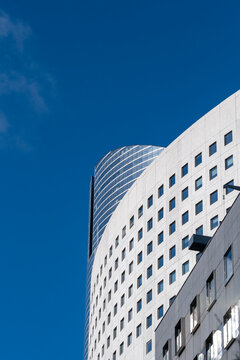 Abstract white curved building facade under pure sky with copy space minimal urban exterior architecture modern pattern for luxury brand identity