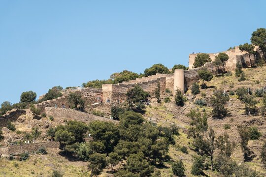 Gibralfaro castle walls on hillside in Malaga Spain