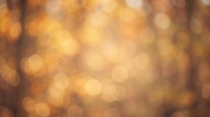 Fototapeta premium Abstract blurred autumn forest background with warm golden bokeh