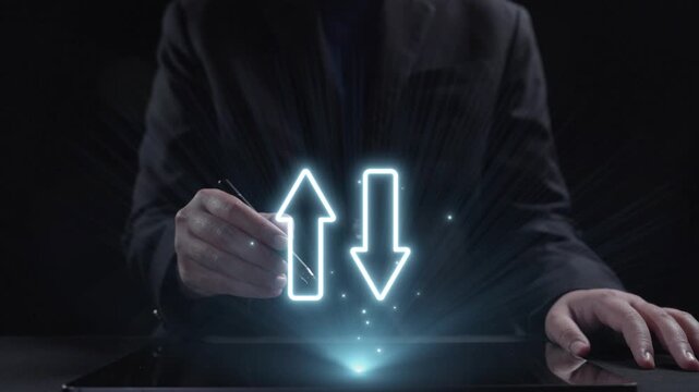 A businessman analyzes key quality and cost indicators using a digital graph displayed on a tablet, emphasizing growth and strategic decision-making in a dark setting. Qubit