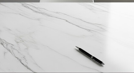 Naklejka premium Minimalist Overhead View of a Black Pen on a White Marble Surface.