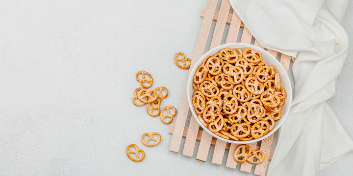 Tasty mini pretzel in a bowl. Traditional food, vegan lifestyle, Oktoberfest symbol concept