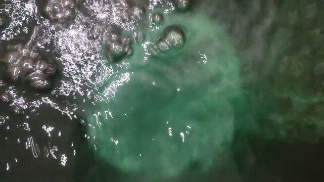 Clear, bubbly water sparkling with fresh purity and soft motion on dark background, ideal for beverage ads and clean hydration visuals.