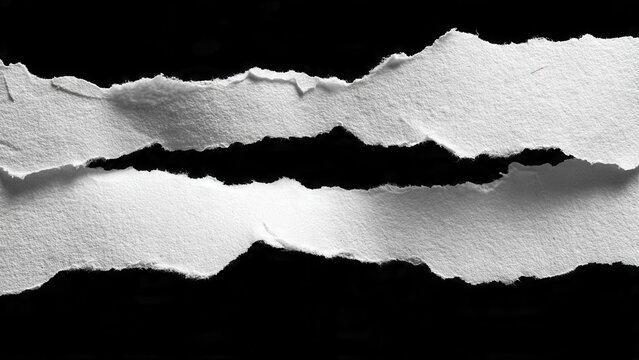 Abstract composition of torn paper strips on black background for creative design