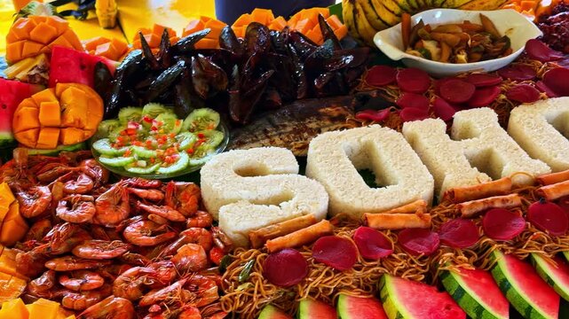 A seafood and fruit buffet with the name Sohoton written on it in rice block letters.