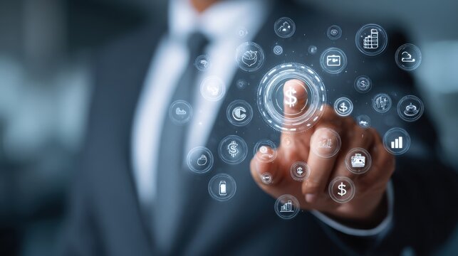A businessman interacts with virtual financial icons displayed in front of him, focusing on budgeting and money management in a clean and modern corporate environment