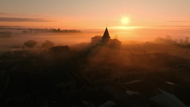 Monpazier Village Church Aerial View at Foggy Sunrise