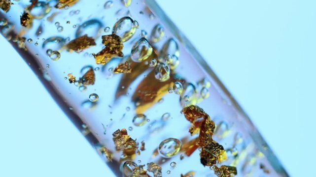 Luxury Cosmetic Product Packshot with Gold Leaf and Bubbles