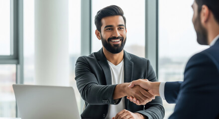 Fototapeta premium A professional handshake between businessmen symbolizes trust, partnership, and the successful closing of a business deal.