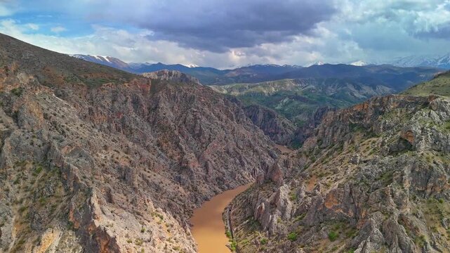 Epic Canyon River Aerial View with Dramatic Clouds