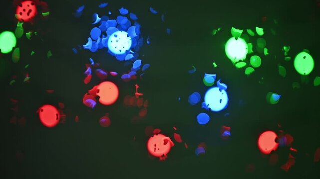 Vibrant colorful glowing orbs floating in dark space with bokeh effect creating mesmerizing abstract background