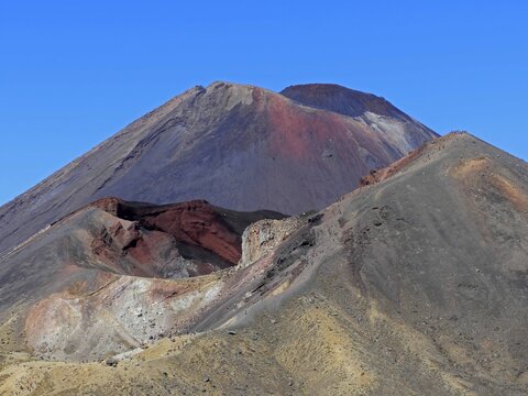 looking  out at the active stratovolcano of mount ngauruhoe from the devil's staircase ascent on the tongariro alpine crossing on the north island of new zealand, on a sunny summer day 