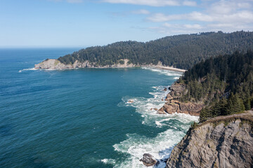 Obraz premium Aerial drone photo of rugged cliffs and ocean waves along the Oregon Coast near Elk Flats Trail, Cape Falcon, Angora Peak, Neahkahnie Mountain, Manzanita USA. Scenic Pacific Ocean shoreline landscape