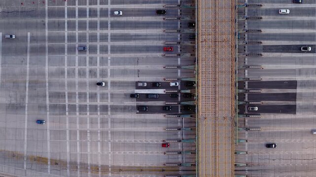 Top drone view of Transport Infrastructure with Toll Plaza collecting fees from vehicles using road