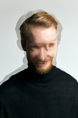 Fototapeta premium Stylish young man with dynamic expression showcasing modern fashion and charm