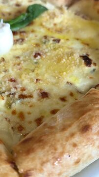 Delicious cheese basil pizza with Fresh Basil Buratto cheese