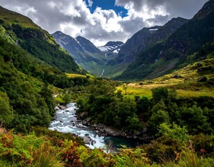 Naklejka premium River flows through a lush valley between mountainous peaks under a cloudy sky, scenic wilderness view