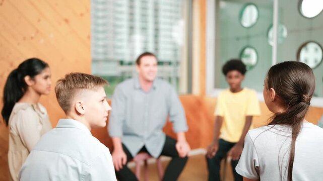 Smart girl raising hand to ask question during doing group therapy. High school student put hand up to ask question, voting, volunteering, asking, answering question between group meeting.Edification