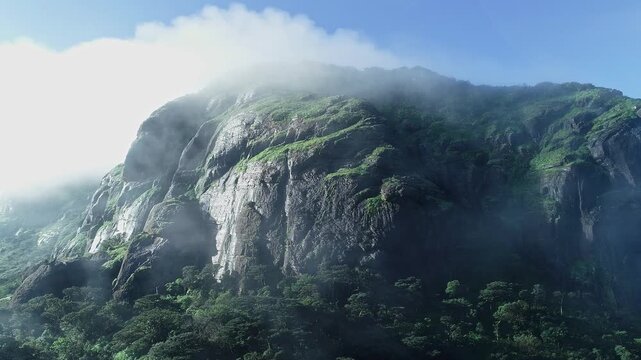 Drone view of Kotebetta cliffs in Western Ghats covered in mist and scenic natural beauty