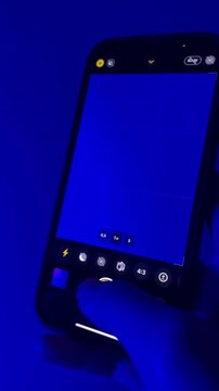 hand holding phone and taking photo vertical video