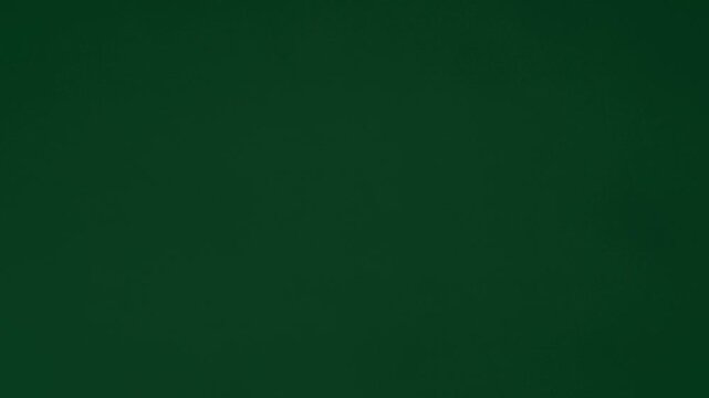 Gift wrapping paper tears from the center on a green background. Stop motion. Layout for discounts, text, etc