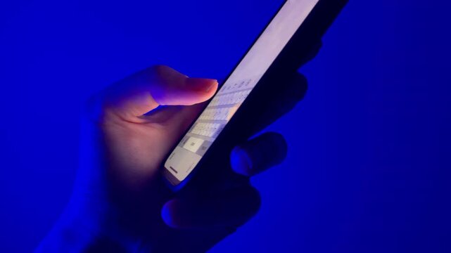 hand holding phone and texting