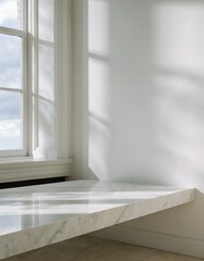 Fototapeta premium Minimalist interior scene with white marble countertop by a window with soft morning sunlight and shadows.