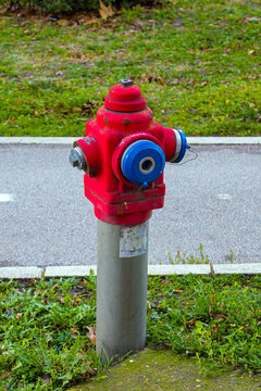 Retro fire hydrant outside in green grass lawn in park