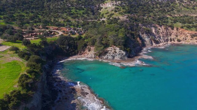 Cinematic Aerial Circling of Secluded Green Lagoon and Rocky Shoreline in Akamas Cyprus