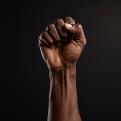 Photorealistic Juneteenth Victorious. Powerful Fist Symbolizing Defiance And Resilience For Juneteenth, African Liberation Day, And Empowerment/Freedom Campaigns