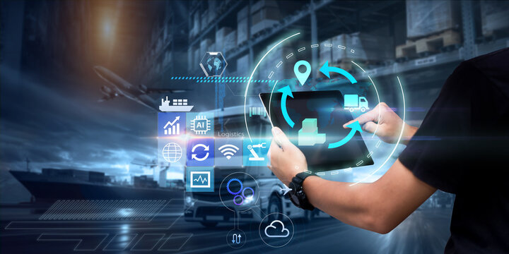 Business Logistics technology concept.Man hands using tablet on blurred warehouse as background