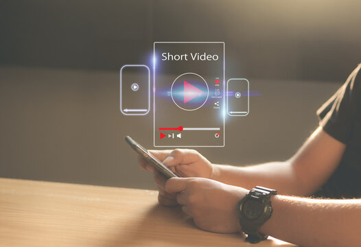 Short,vertical Video marketing concept.Man hands holding mobie phone short video player