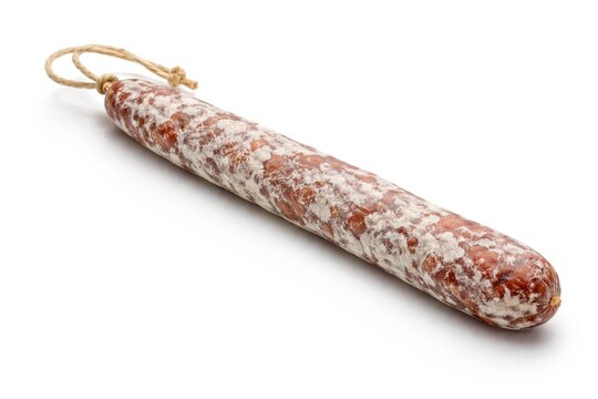 Sharp image of dry cured fuet sausage lying flat against white background