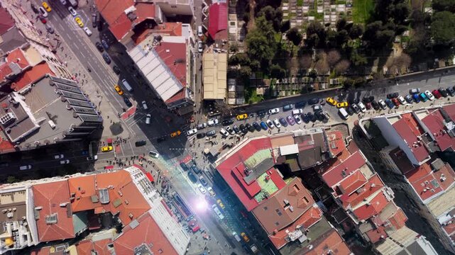 Aerial survey of a city with autonomous cars driving and sharing data with futuristic graphics and digital overlay showing self driving vehicle technology and information