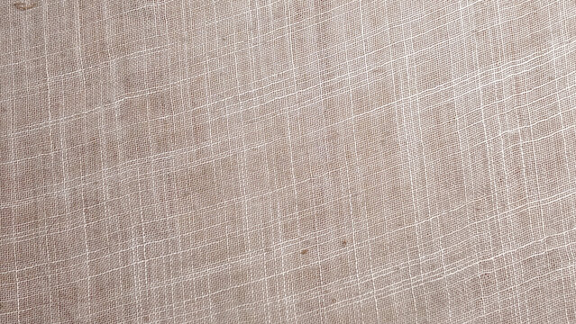 Coarse Woven Beige Fabric Texture with Natural Raw Thread Pattern and Rough Textile Surface Background