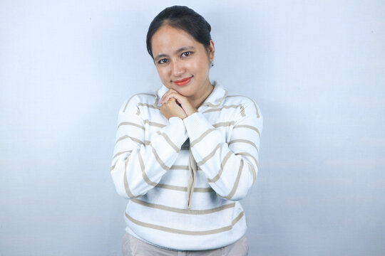 Portrait of gorgeous pretty woman with sweater hold arms on cheekbones isolated on white background