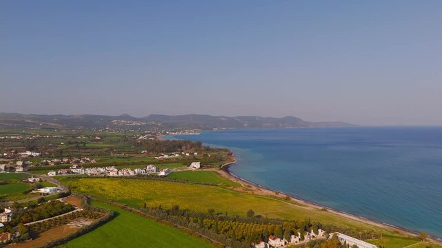 Aerial High Altitude Rise Above Cyprus Coast Toward Latsi Harbor and Akamas